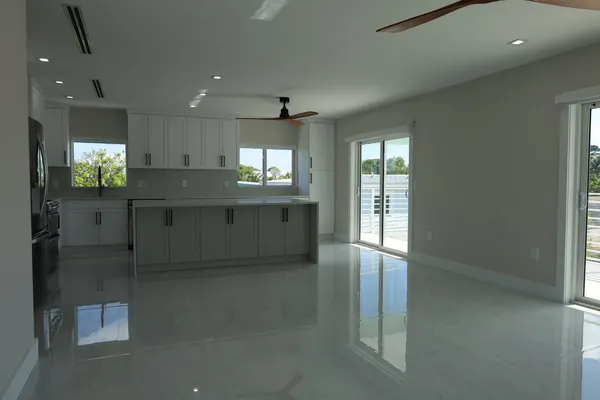 a kitchen with stainless steel appliances granite countertop a sink and a stove top oven