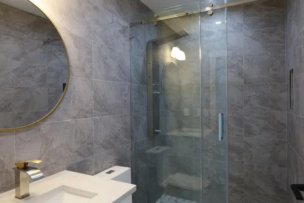 a bathroom with a shower and toilet