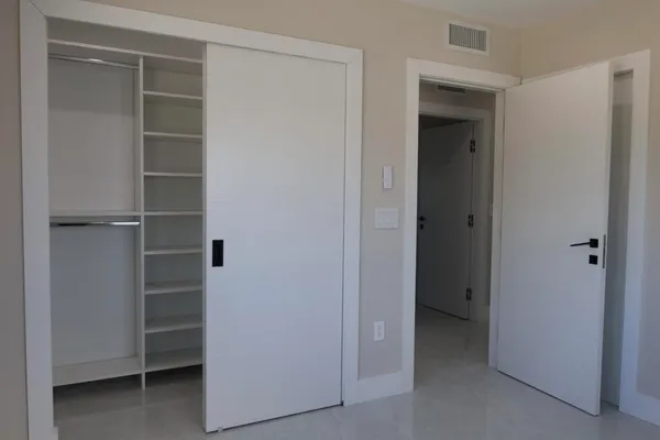 a view of an empty walk in closet