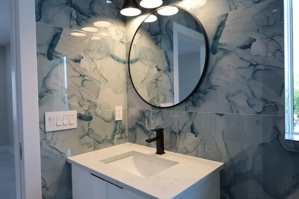 a bathroom with a sink and a mirror