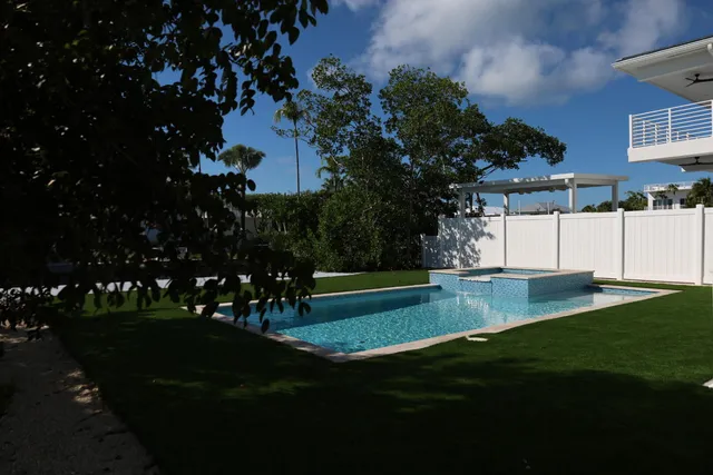 a view of a park with plants and trees
