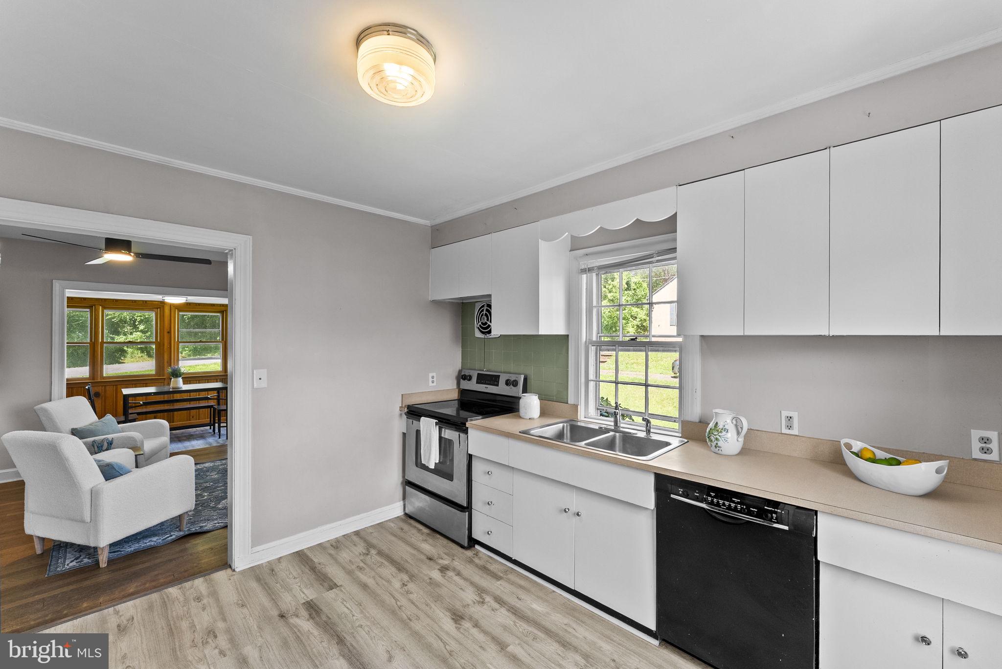 539 Old Meetze Road Warrenton, VA 20186 - Photo 20 of 30 a kitchen with a window a sink and a counter space