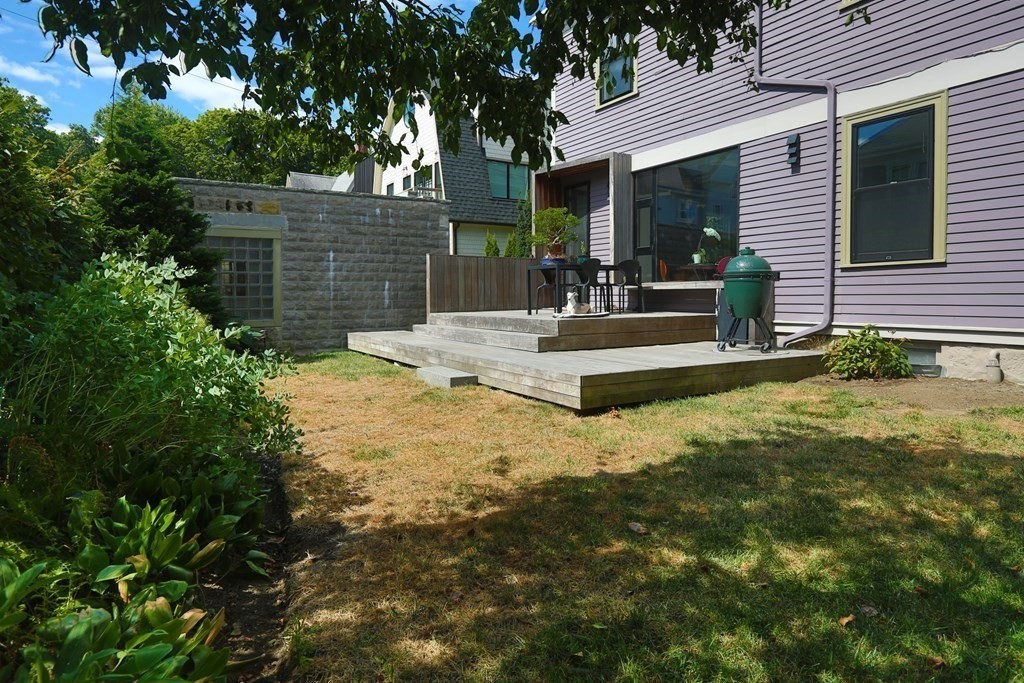 33 Thorndike Street Brookline, MA 02446 - Photo 12 of 13 a view of house with backyard and sitting area