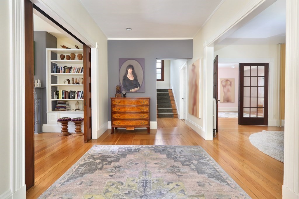 33 Thorndike Street Brookline, MA 02446 - Photo 2 of 13 a living room with furniture and a rug