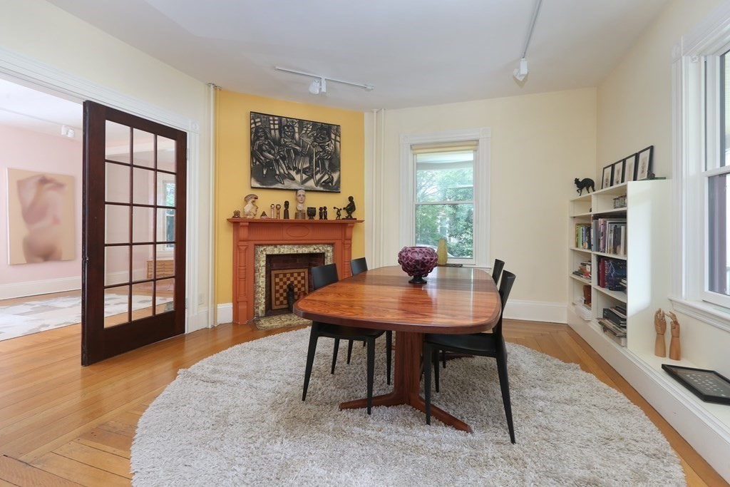 33 Thorndike Street Brookline, MA 02446 - Photo 3 of 13 a view of a workspace with furniture and a bookshelf