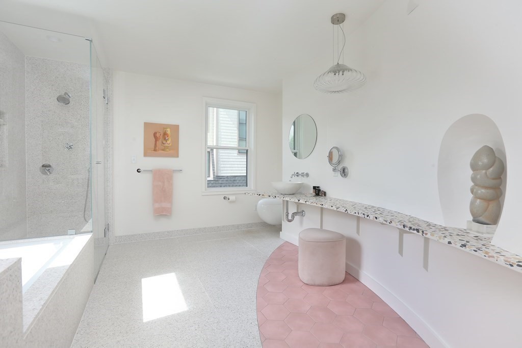 33 Thorndike Street Brookline, MA 02446 - Photo 8 of 13 a bathroom with a tub sink and mirror