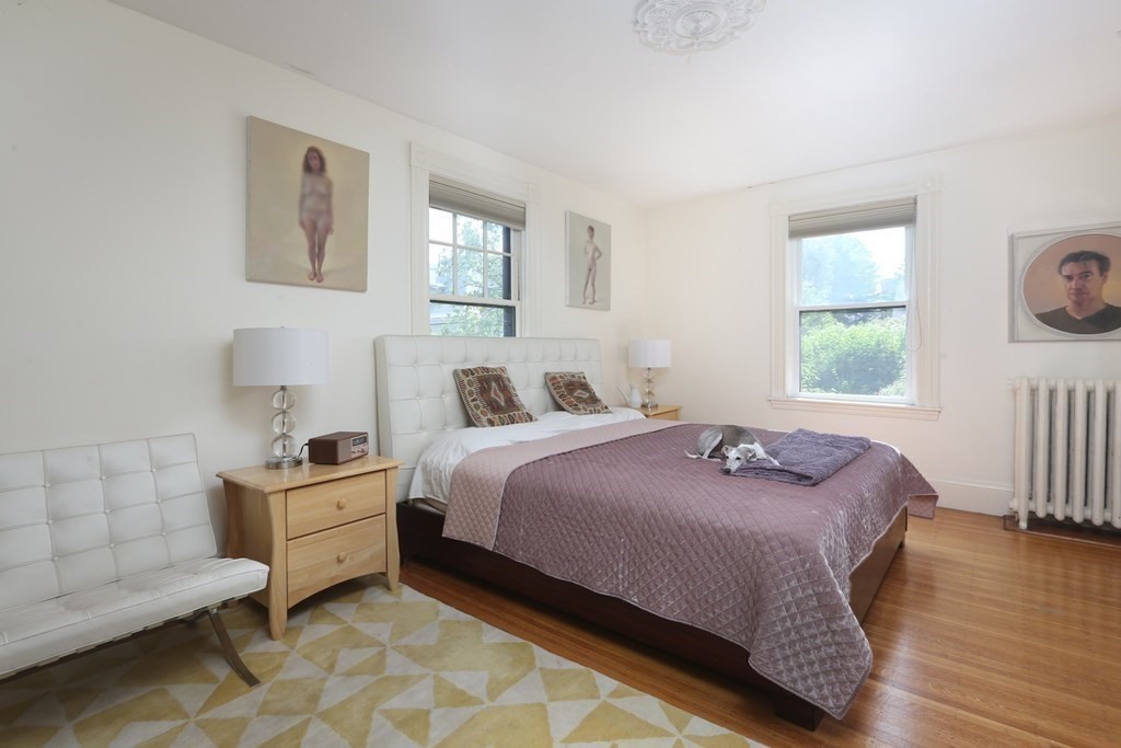 33 Thorndike Street Brookline, MA 02446 - Photo 9 of 13 a bedroom with a bed and a window