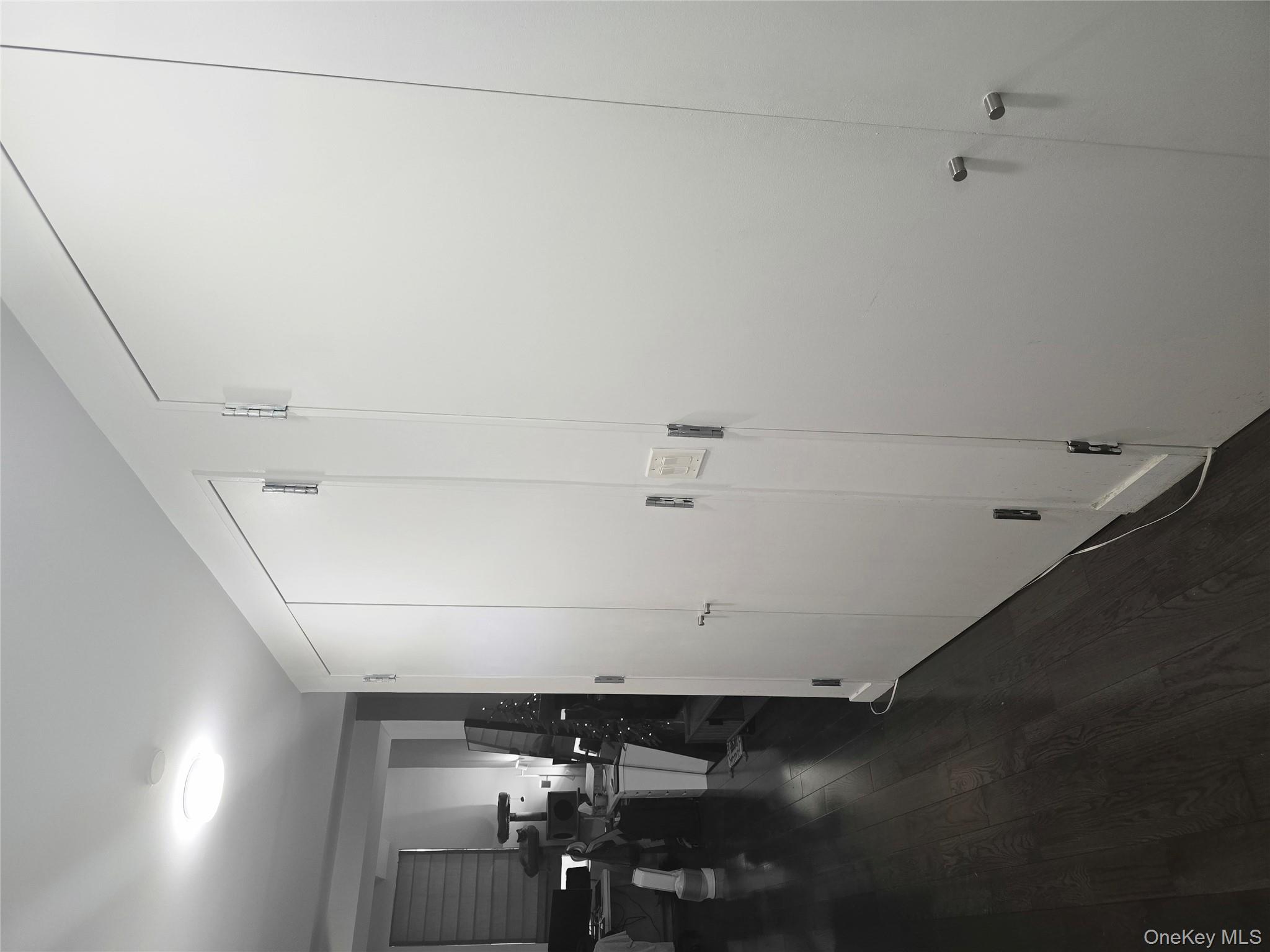 119 Fulton Street, Unit 5B Manhattan, NY 10038 - Photo 4 of 15 Hall featuring dark wood-style flooring