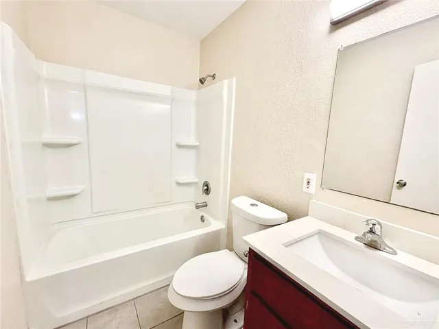 a bathroom with a sink a toilet and a bathtub