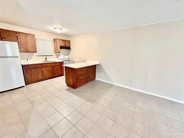a view of kitchen with furniture and wooden floor