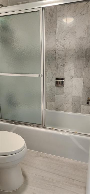 299 North Riverside Drive, Unit 303 Pompano Beach, FL 33062 - Photo 25 of 40 a bathroom with a toilet and a shower