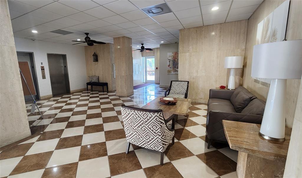 299 North Riverside Drive, Unit 303 Pompano Beach, FL 33062 - Photo 27 of 40 a living room with a black white checkered floor with a black white checkered floor