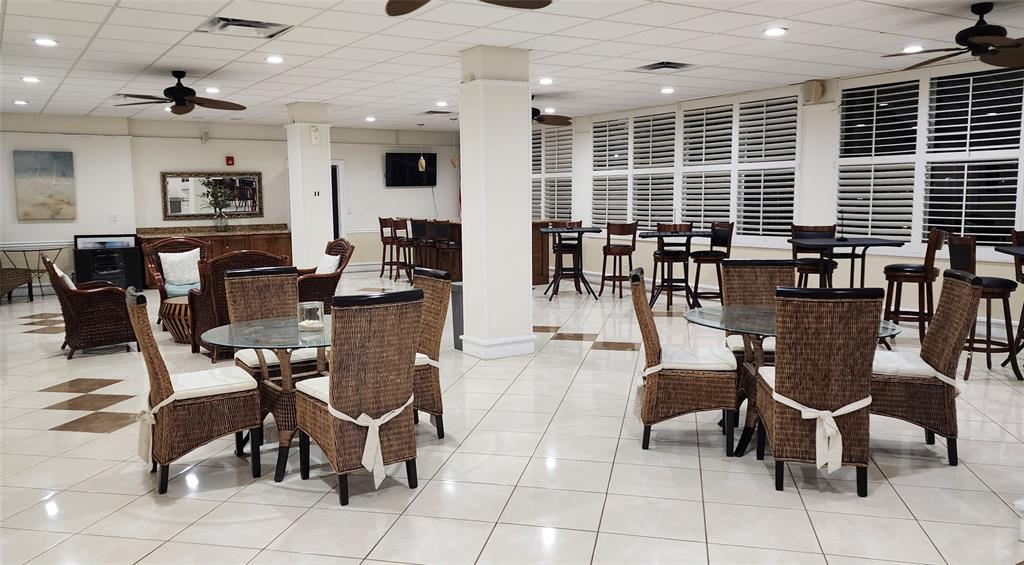 299 North Riverside Drive, Unit 303 Pompano Beach, FL 33062 - Photo 29 of 40 a view of a dining room with furniture
