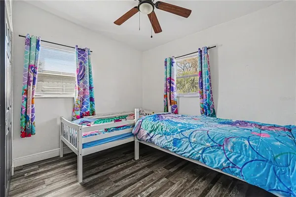 a bedroom with a bed and a dresser