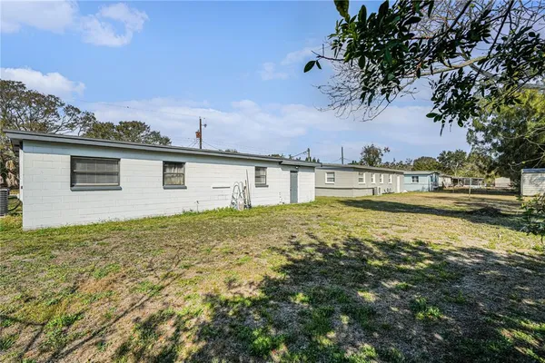a view of a swimming pool with an outdoor space and seating area
