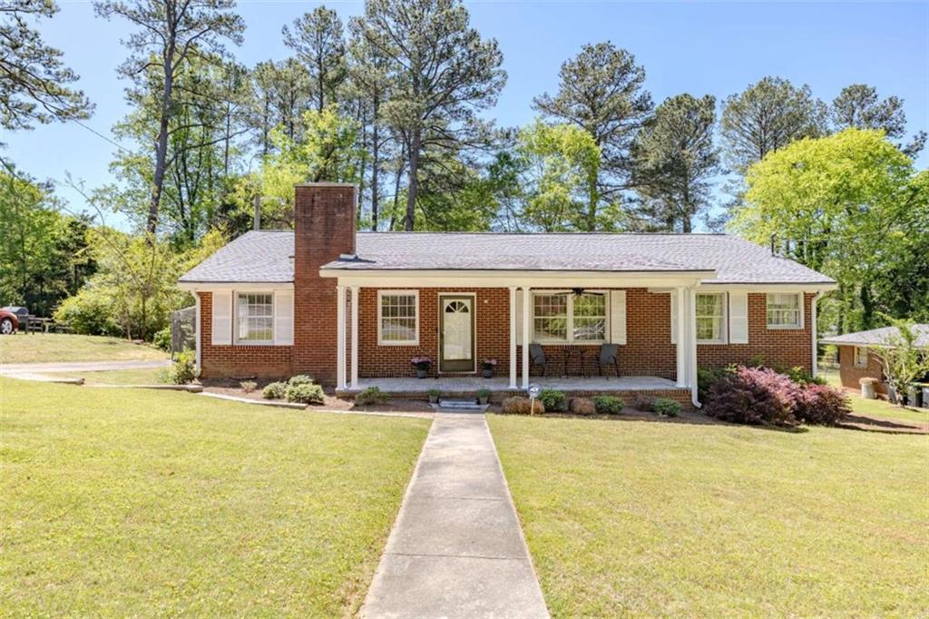 112 East Valley Road Northeast Rome, GA 30161 - Photo 1 of 1 a front view of a house with swimming pool having outdoor seating