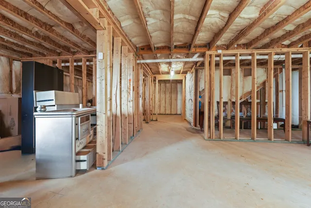 a view of an empty room with wooden walls