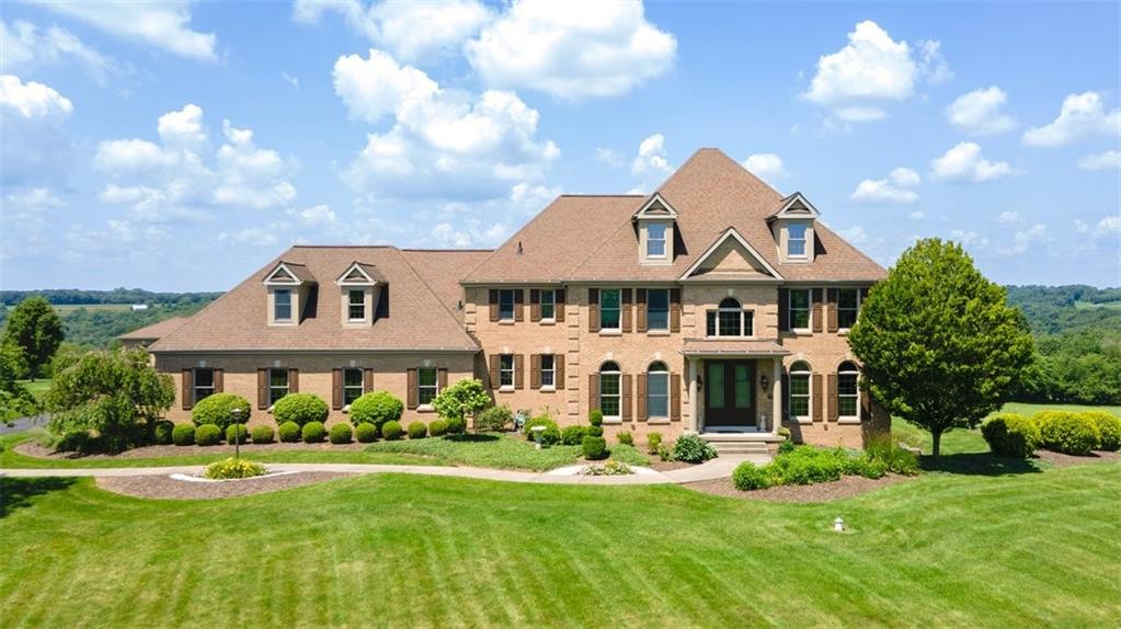 225 Church Road Fombell, PA 16123 - Photo 1 of 45 a front view of a house with garden