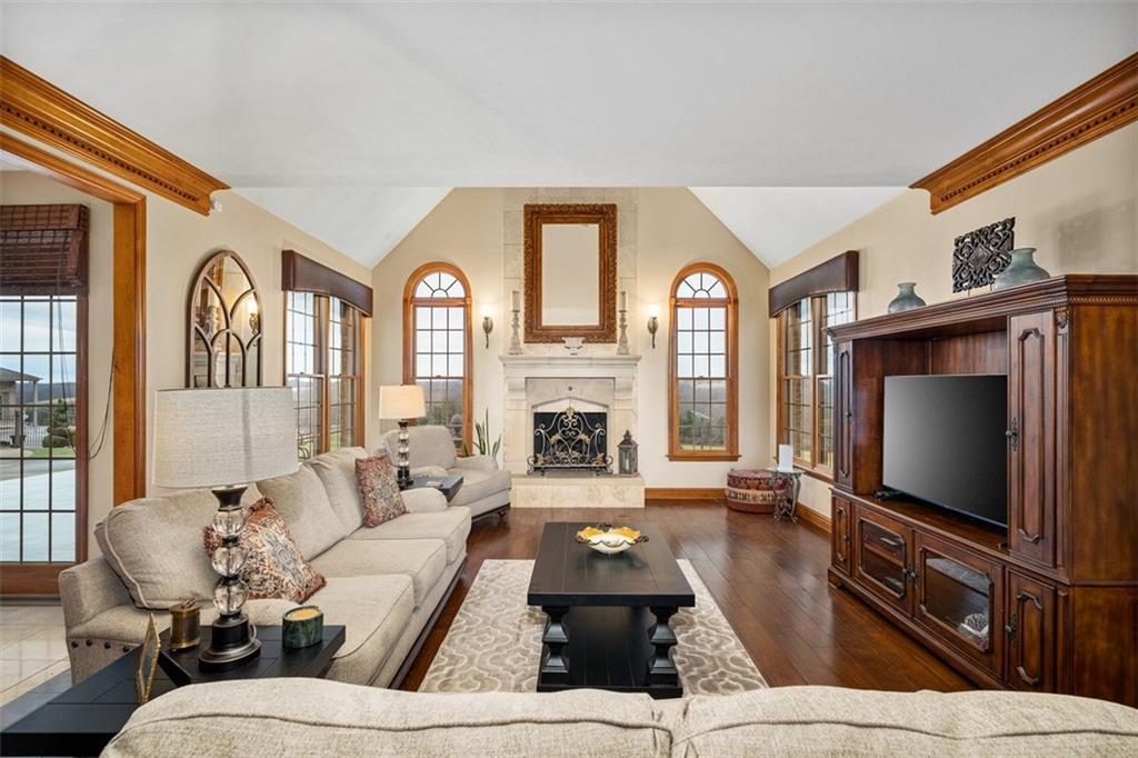 225 Church Road Fombell, PA 16123 - Photo 12 of 45 a living room with furniture a large window and a flat screen tv