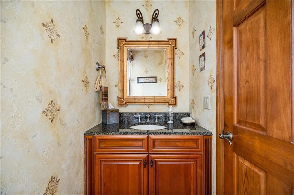 225 Church Road Fombell, PA 16123 - Photo 20 of 45 a bathroom with a granite countertop sink a mirror and a shower curtain