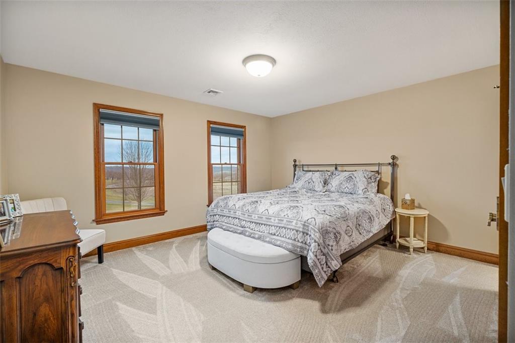 225 Church Road Fombell, PA 16123 - Photo 28 of 45 a spacious bedroom with a bed and window