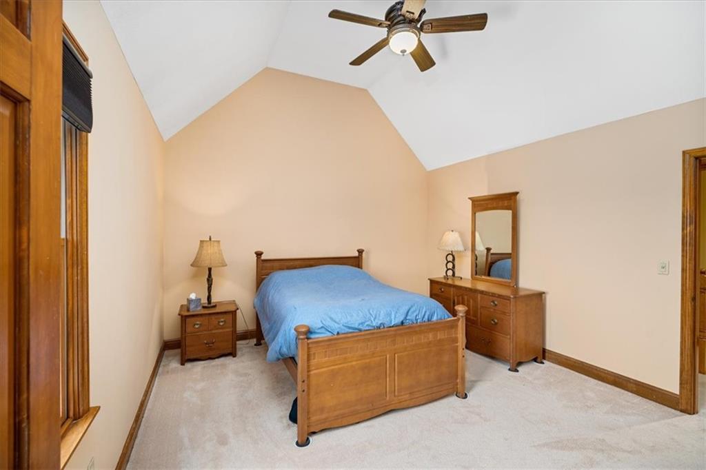 225 Church Road Fombell, PA 16123 - Photo 31 of 45 a room with a bed and a chandelier fan