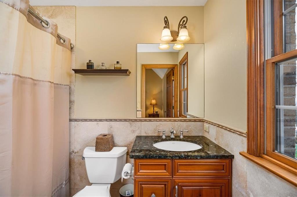 225 Church Road Fombell, PA 16123 - Photo 32 of 45 a bathroom with a granite countertop sink and a mirror