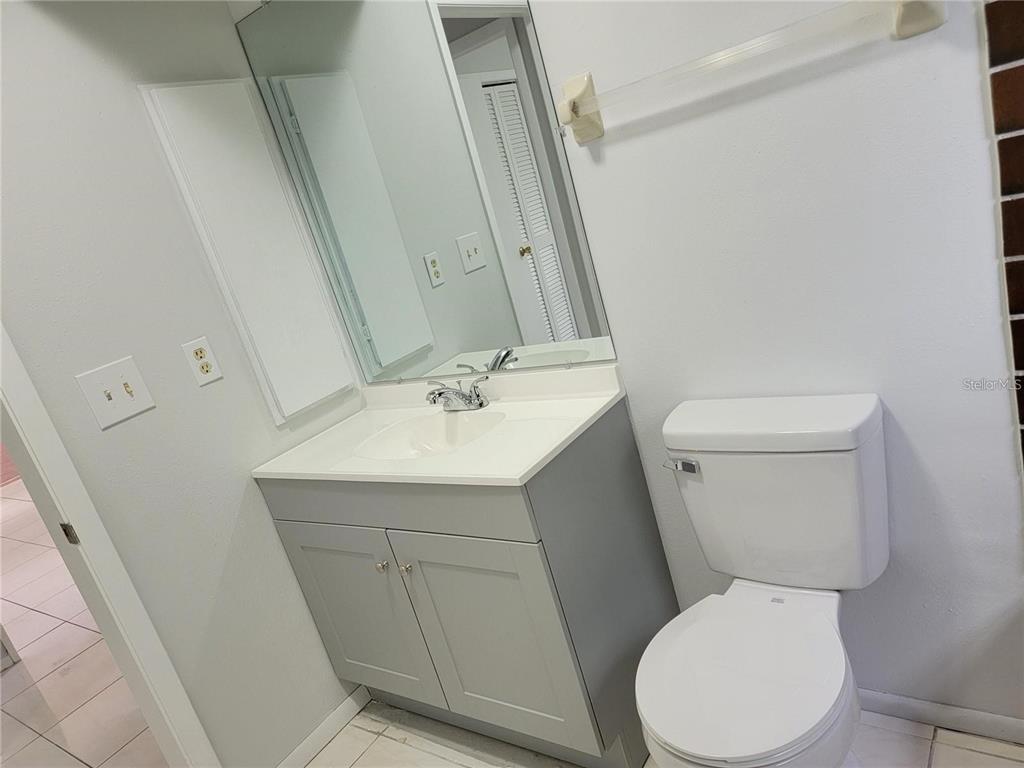 26221 Constantine Road Punta Gorda, FL 33983 - Photo 20 of 27 a white toilet sitting next to a bathroom sink