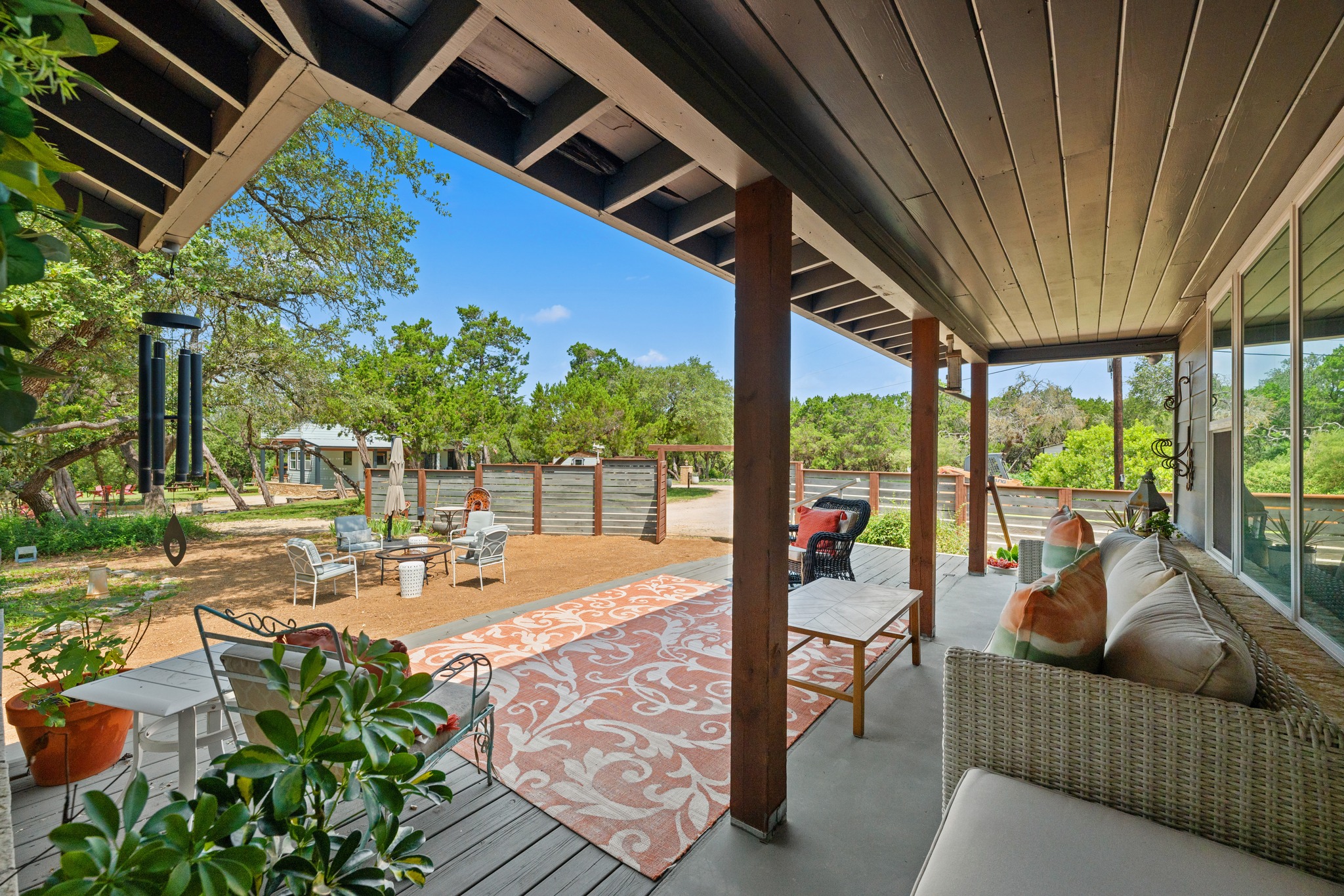 12932 Nutty Brown Road Austin, TX 78737 - Photo 29 of 40 The Ranch - Inviting covered front porch overlooking beautifully maintained grounds.