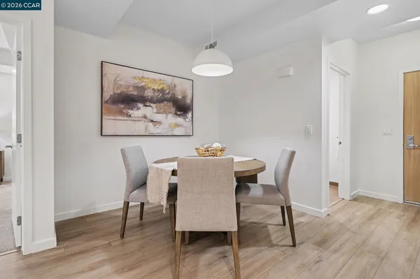 a view of a dining room with furniture wooden floor and a chandelier