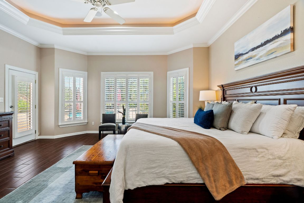 218 Courtnee's Way Georgetown, TX 78626 - Photo 17 of 36 The spacious primary bedroom is filled with natural light from a beautiful bay window, creating a bright and airy atmosphere. The generous layout offers plenty of room for both rest and relaxation, while the bay window provides the perfect nook for a cozy reading chair or quiet morning coffee with serene views of the outdoors ~
