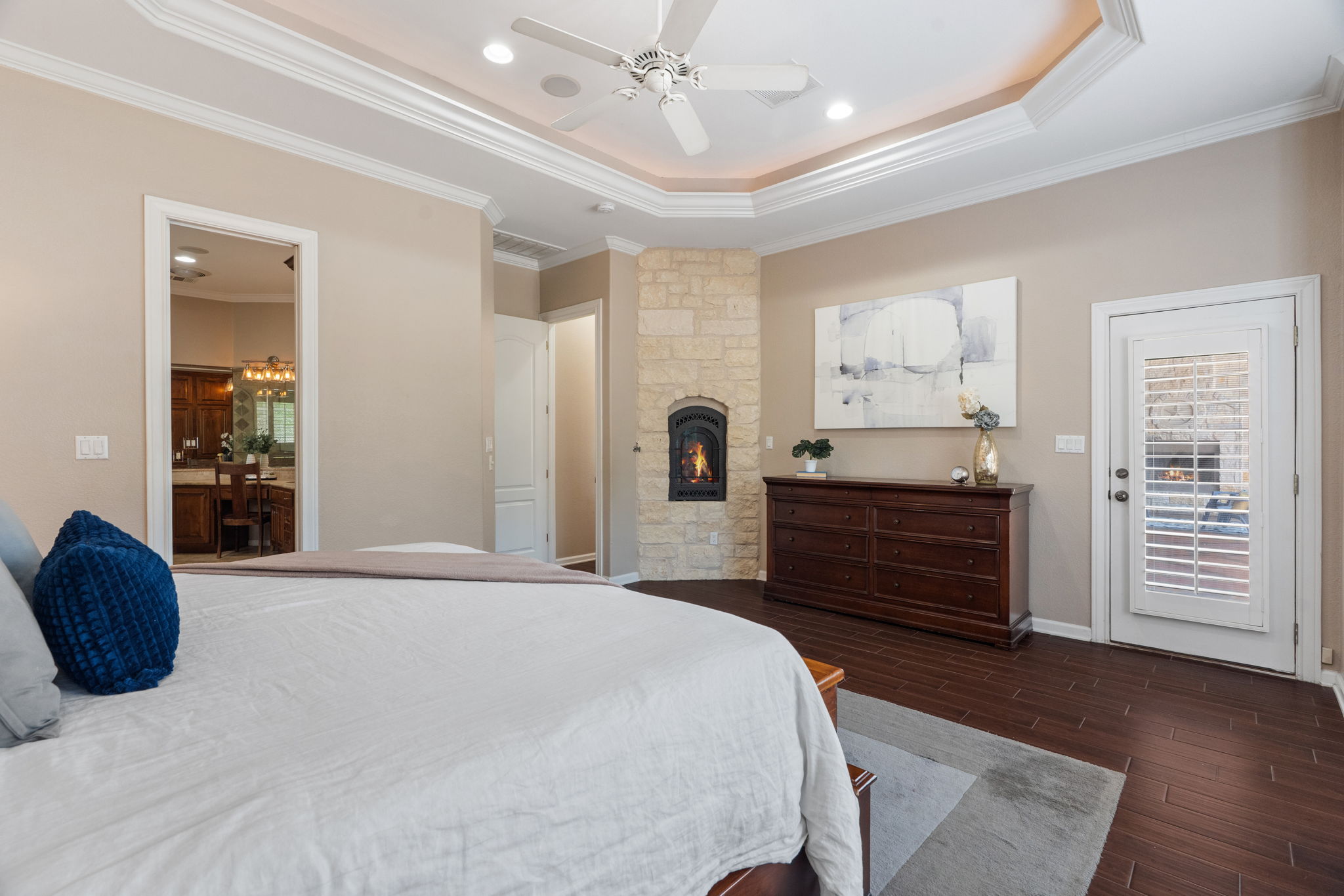 218 Courtnee's Way Georgetown, TX 78626 - Photo 18 of 36 a bedroom with a bed and a chandelier