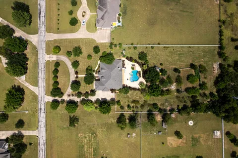 an aerial view of residential house with outdoor space