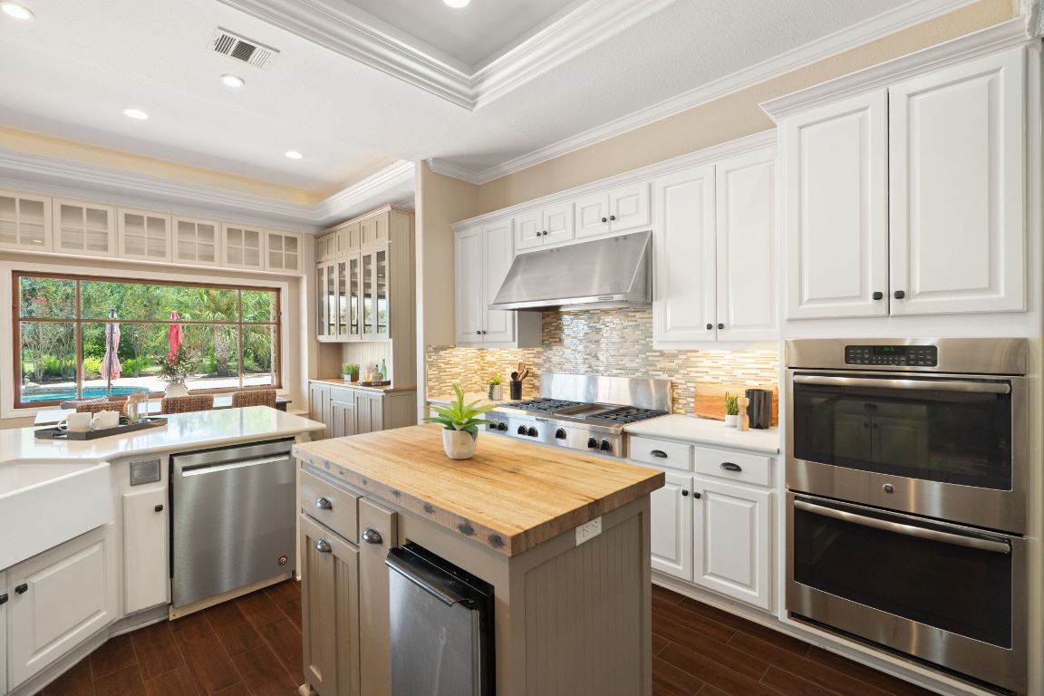 218 Courtnee's Way Georgetown, TX 78626 - Photo 10 of 36 The open design flows seamlessly into the bright breakfast nook, where large windows bathe the space in natural light, creating the perfect setting for both casual meals and relaxed morning coffee ~