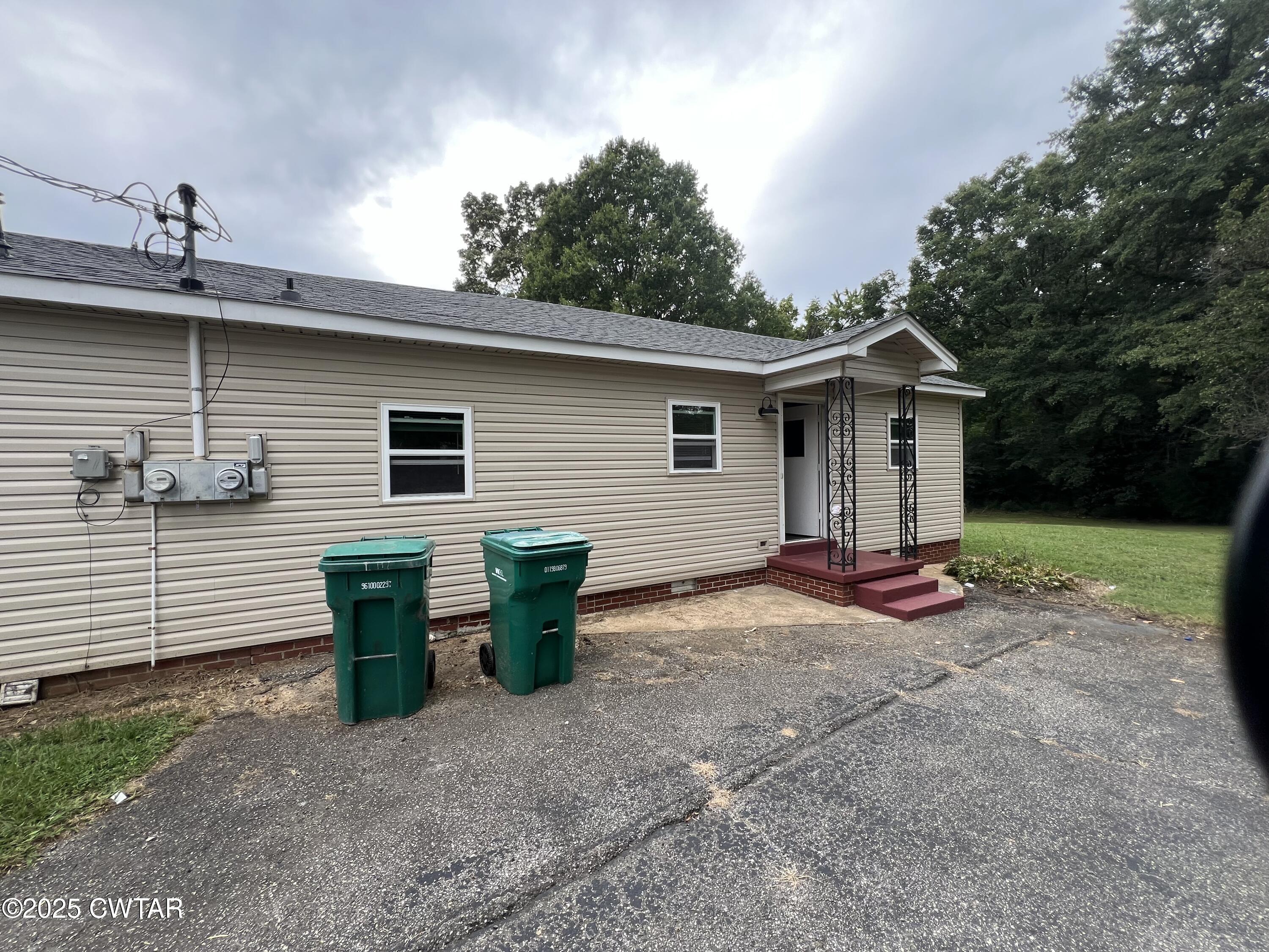 1056 Phelps Lane Milan, TN 38358 - Photo 3 of 17 a view of a house with backyard