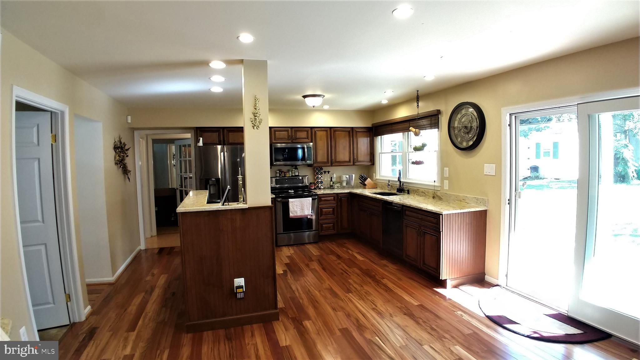 5582 Quiet Brook Road Fairfax, VA 22030 - Photo 12 of 31 Brightly lit kitchen has backyard view and access.