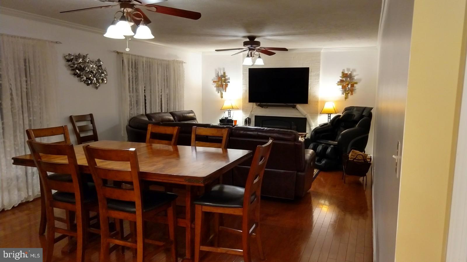 5582 Quiet Brook Road Fairfax, VA 22030 - Photo 17 of 31 Cozy living room with wood stove insert.