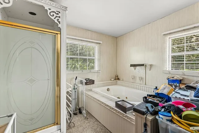 a bedroom with furniture and a chandelier