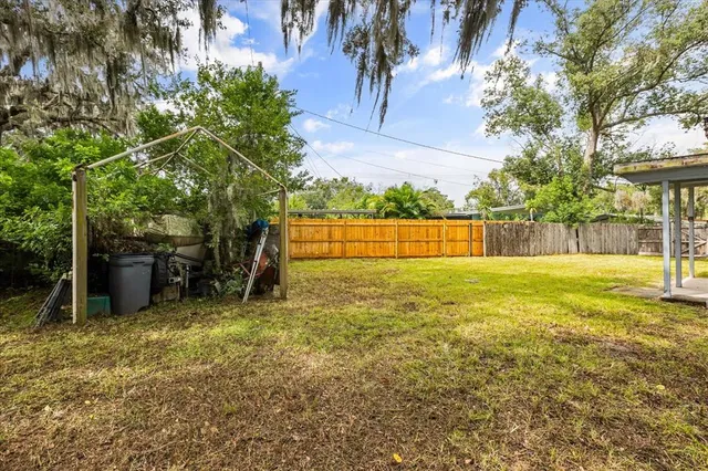 a view of a house with pool and tree s