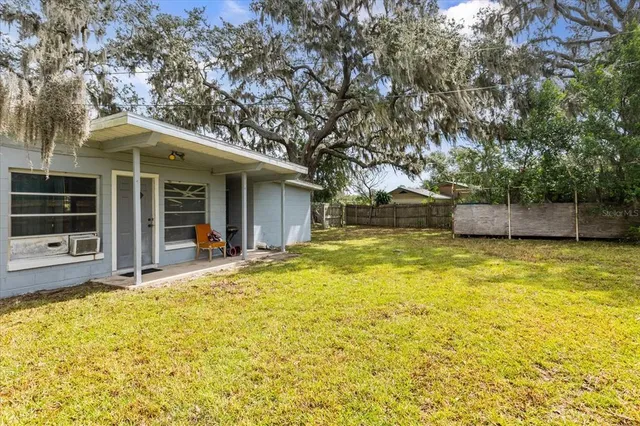 a view of an empty room with wooden walls