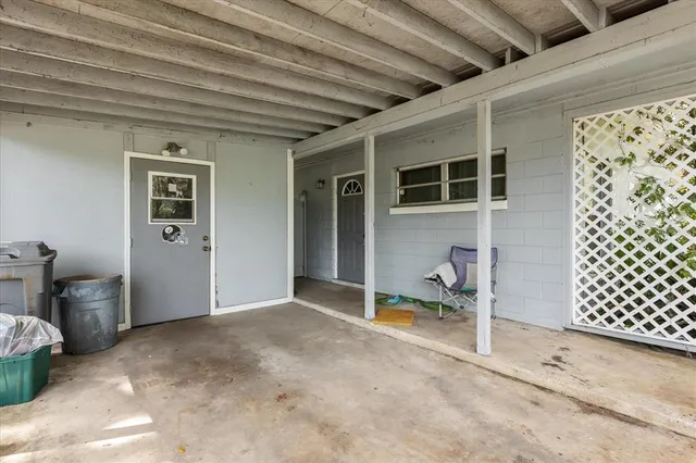 a view of a swimming pool with a yard