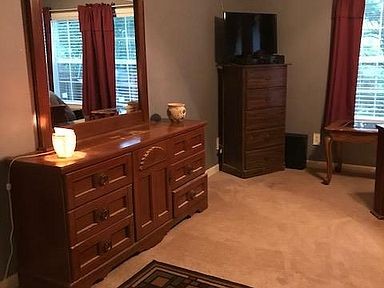 503 Bruce Road Dickson, TN 37055 - Photo 8 of 13 a room with a dresser and a window