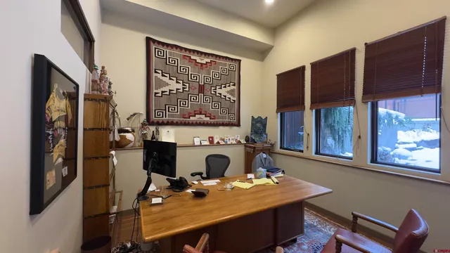 a view of a workspace with furniture