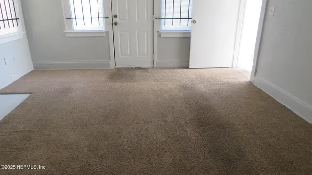 an empty room with windows