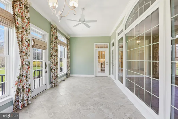 a kitchen with stainless steel appliances granite countertop a sink and dishwasher with white cabinets