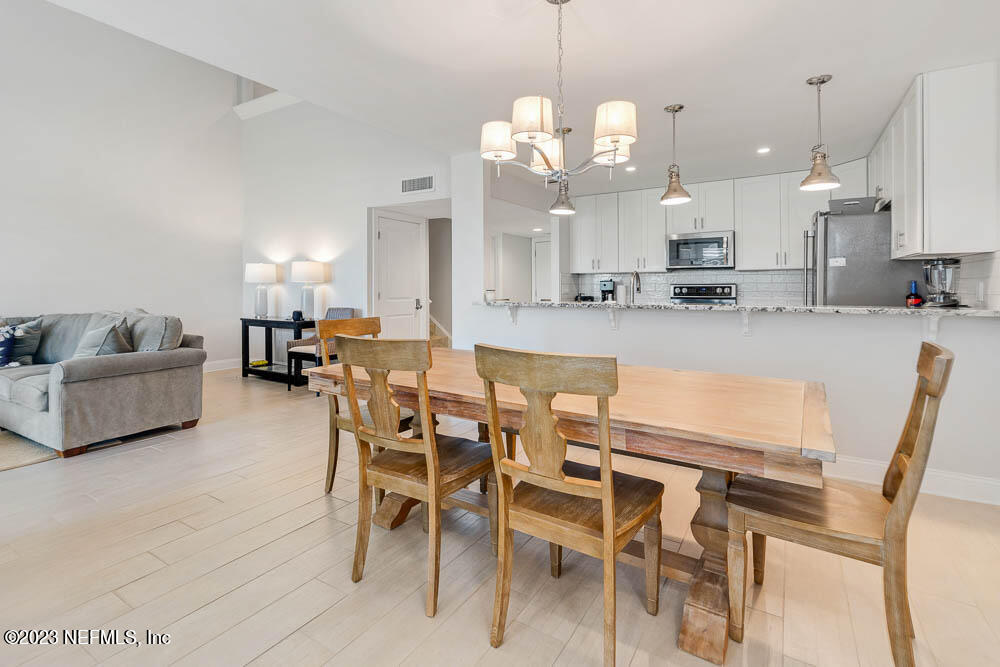 10 Cove Road Ponte Vedra Beach, FL 32082 - Photo 15 of 31 a large kitchen with a table and chairs