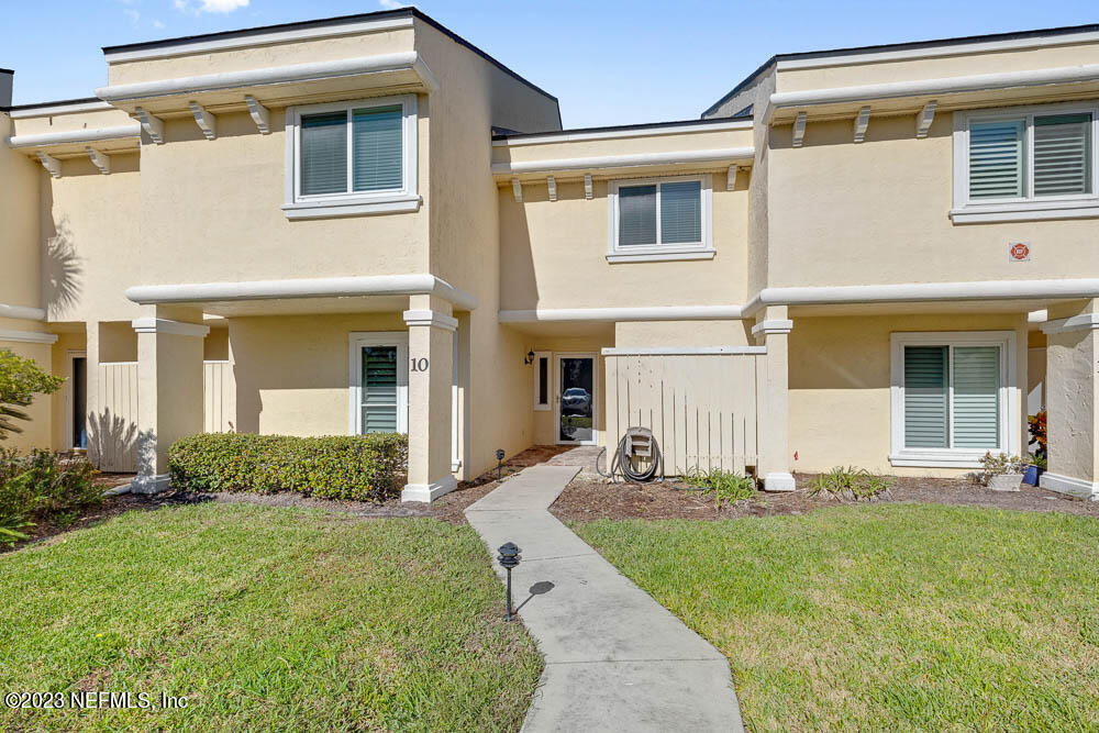 10 Cove Road Ponte Vedra Beach, FL 32082 - Photo 2 of 31 a front view of a house with a yard