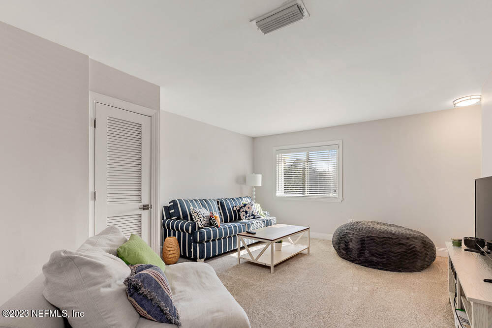 10 Cove Road Ponte Vedra Beach, FL 32082 - Photo 24 of 31 a bedroom with a bed and a window