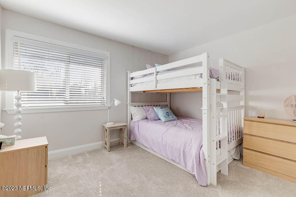 10 Cove Road Ponte Vedra Beach, FL 32082 - Photo 27 of 31 a bedroom with a bed and a window