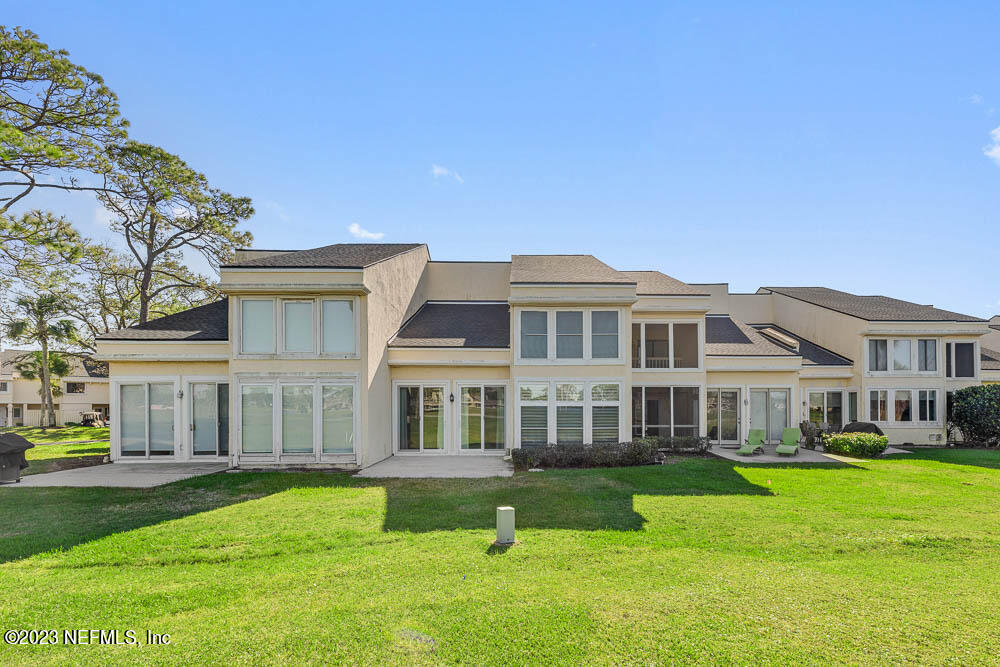 10 Cove Road Ponte Vedra Beach, FL 32082 - Photo 28 of 31 a front view of a building with a garden